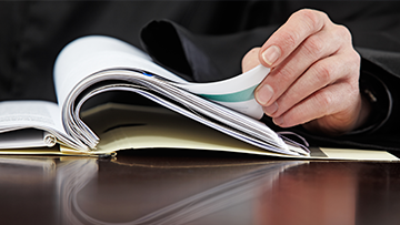 Someone is turning the pages of a document
